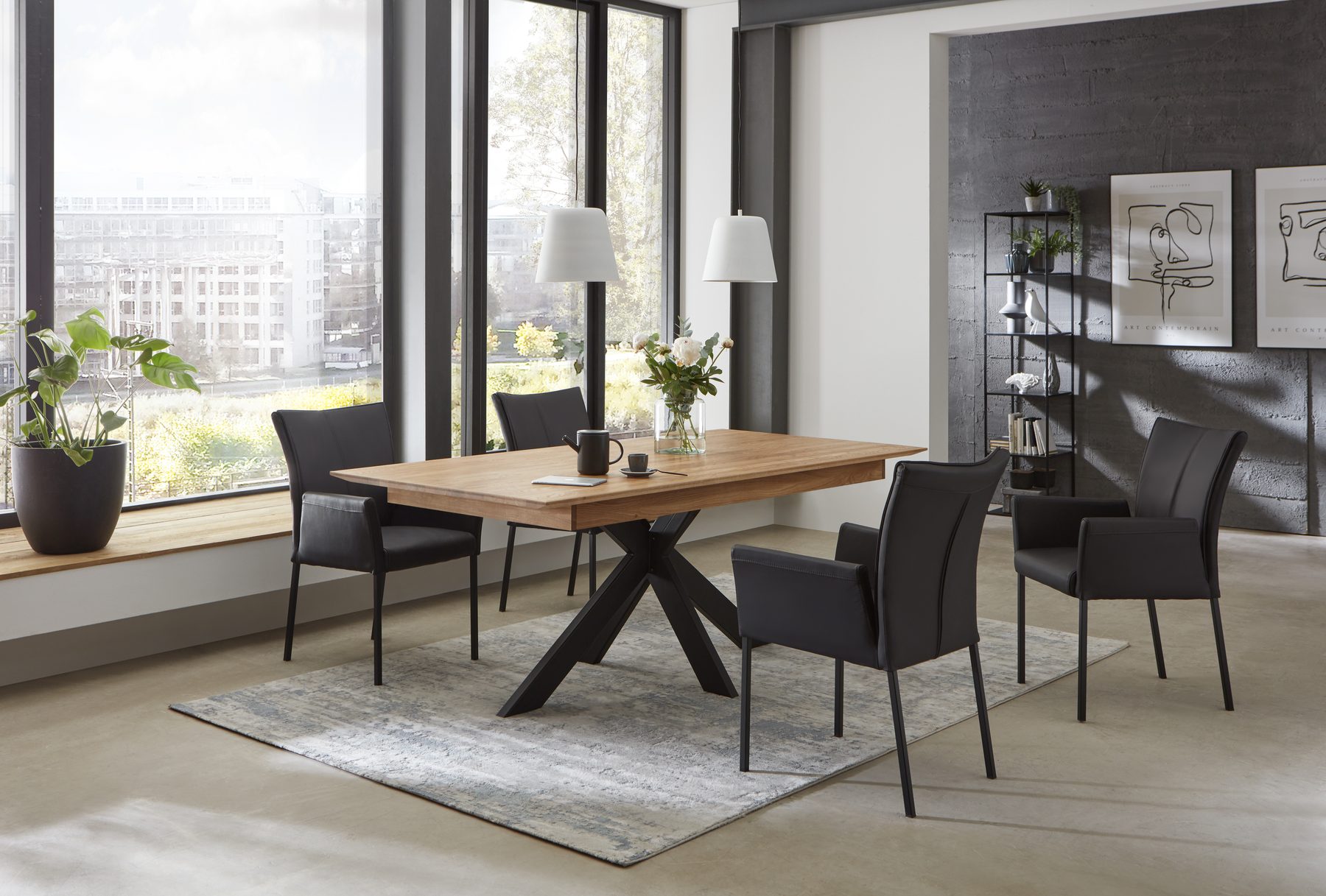 Boston extending dining table — solid-wood top on a sculptural steel base