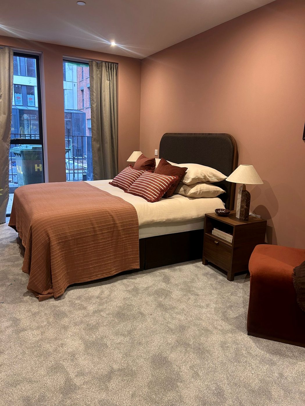Birmingham apartment — bedroom in warm terracotta