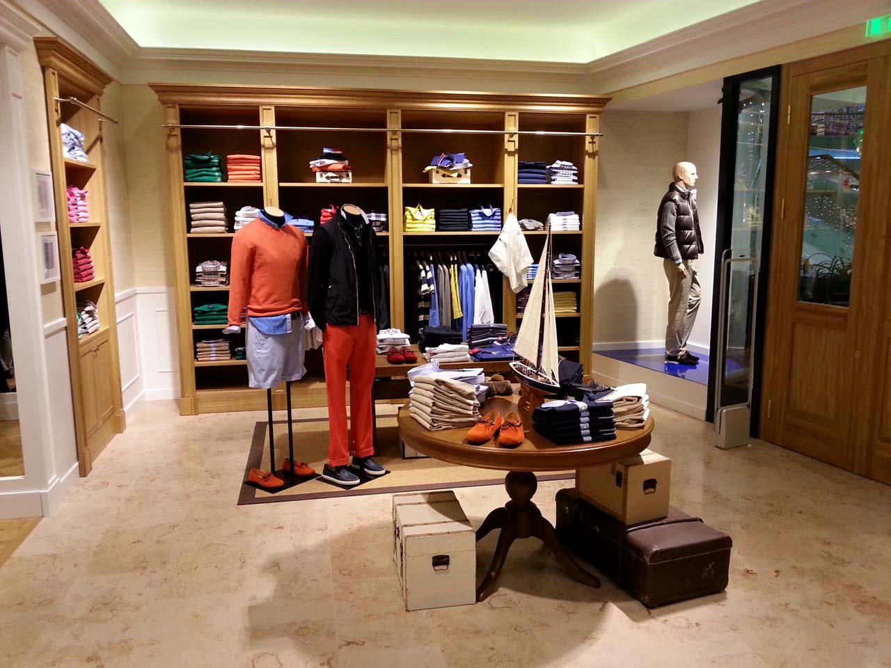 Façonnable boutique — central display table and shelving