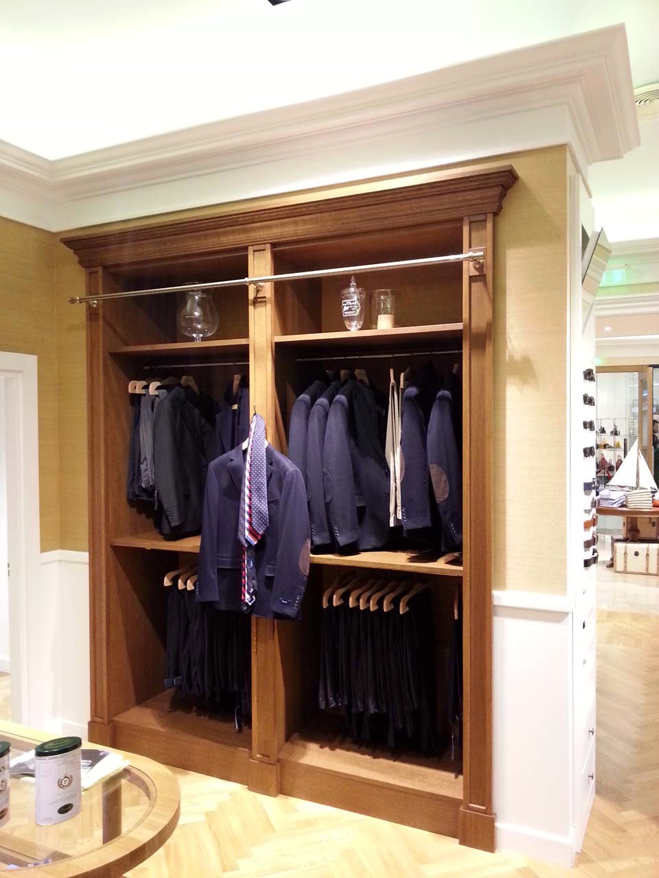 Façonnable boutique — wardrobes and round display table
