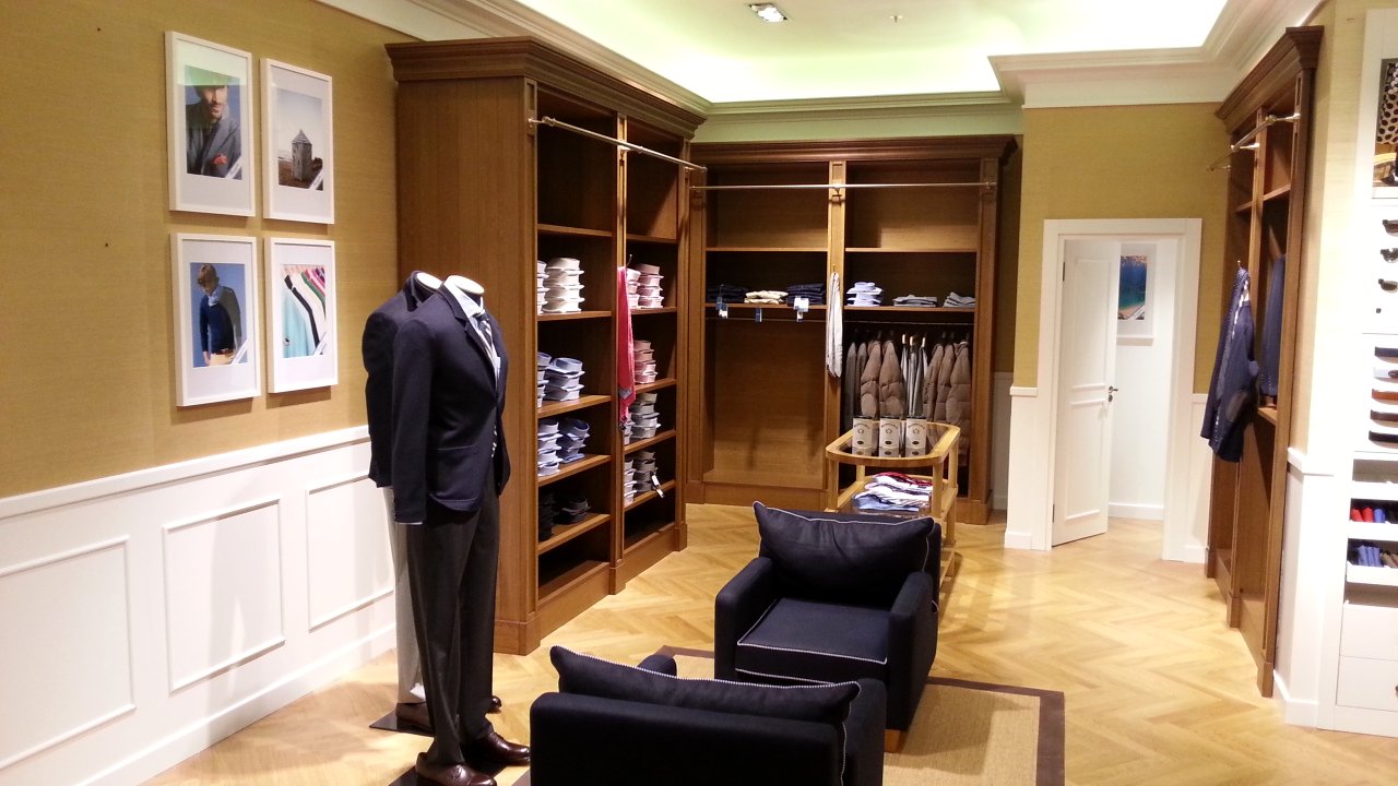 Façonnable boutique — seating corner with armchair