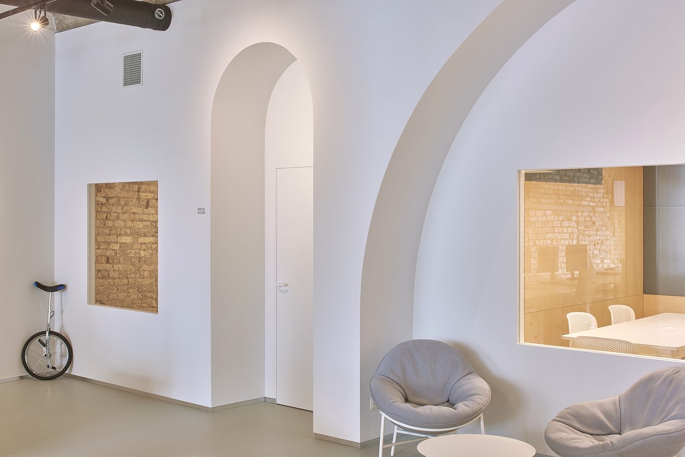 Wix offices — breakout seating in an arched room