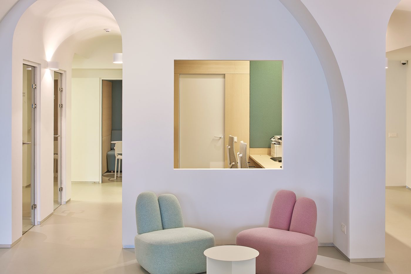 Wix offices — pastel breakout armchairs